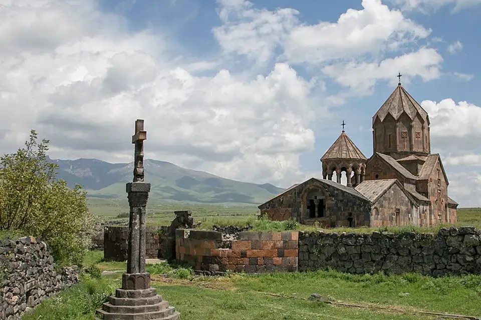 Medieval Hovhannavank Monastery with an ancient khachkar and Mount Ara in the background