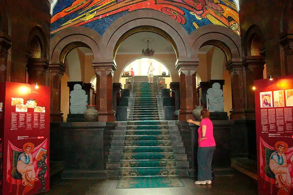 Interior of an exhibition hall at the Matenadaran in Yerevan, with manuscript display cases