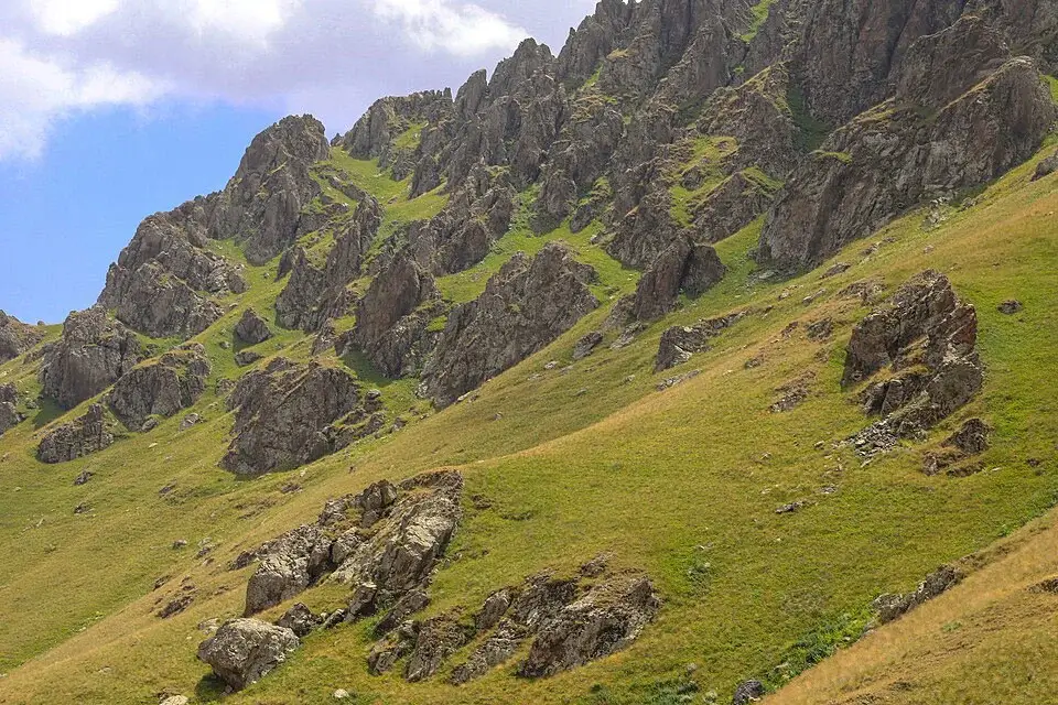 Rocky slopes and alpine meadows on the Mount Khustup hiking trail