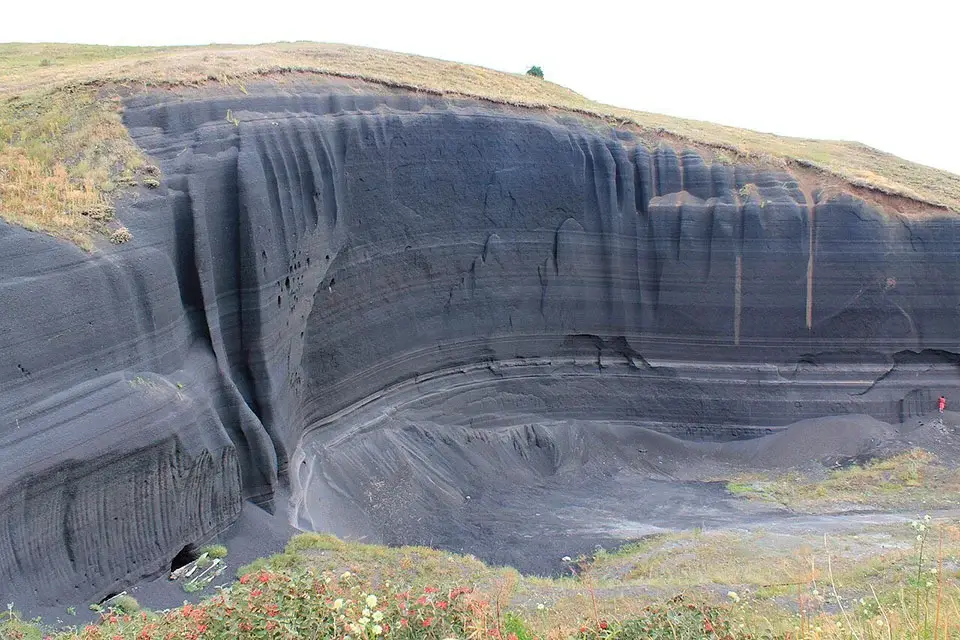 Close-up view of the Black Wall volcanic rock formation near Mount Gutanasar